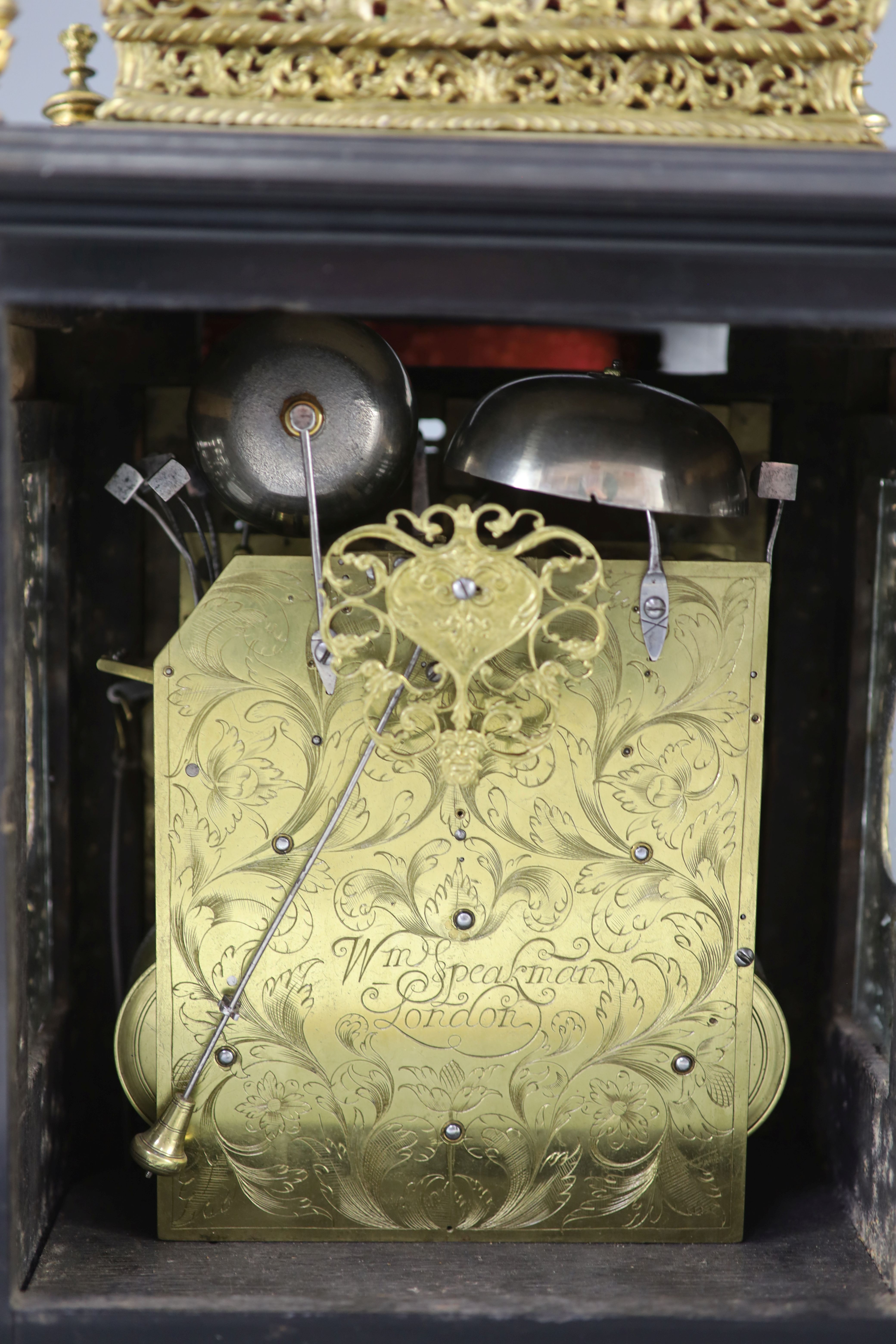 A William III ebonised cased and gilt metal double basket topped chiming and quarter repeating table clock, height 17in.